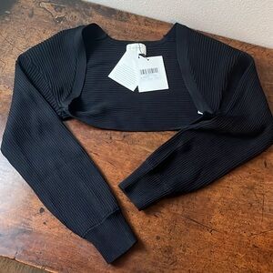 New with tags Dissh Raven Black Knit Bolero Size Medium 
No snags or pulls.